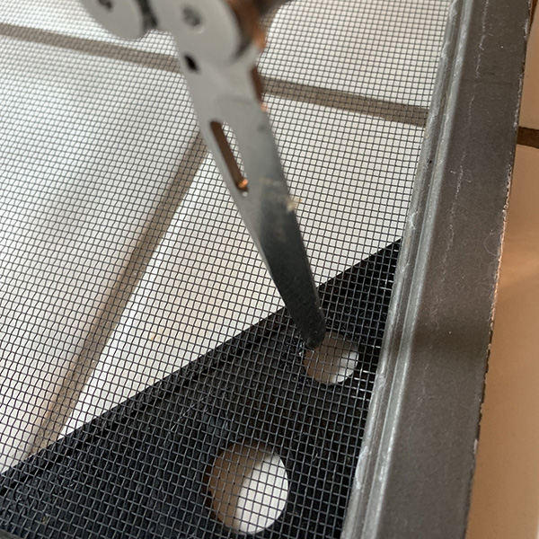 making a hole in a chameleon screen cage top
