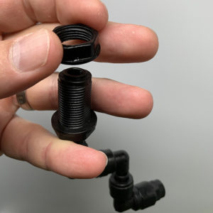 Remove-nut-540 removing the nut from the misting nozzle